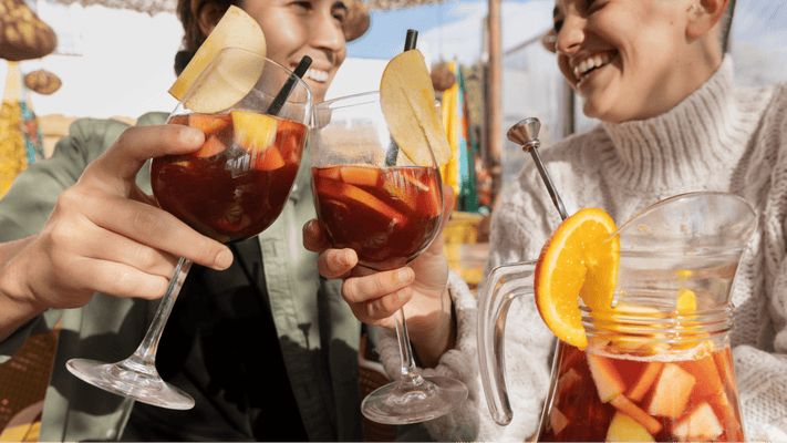 Cheersing glasses of Sangria | Macy